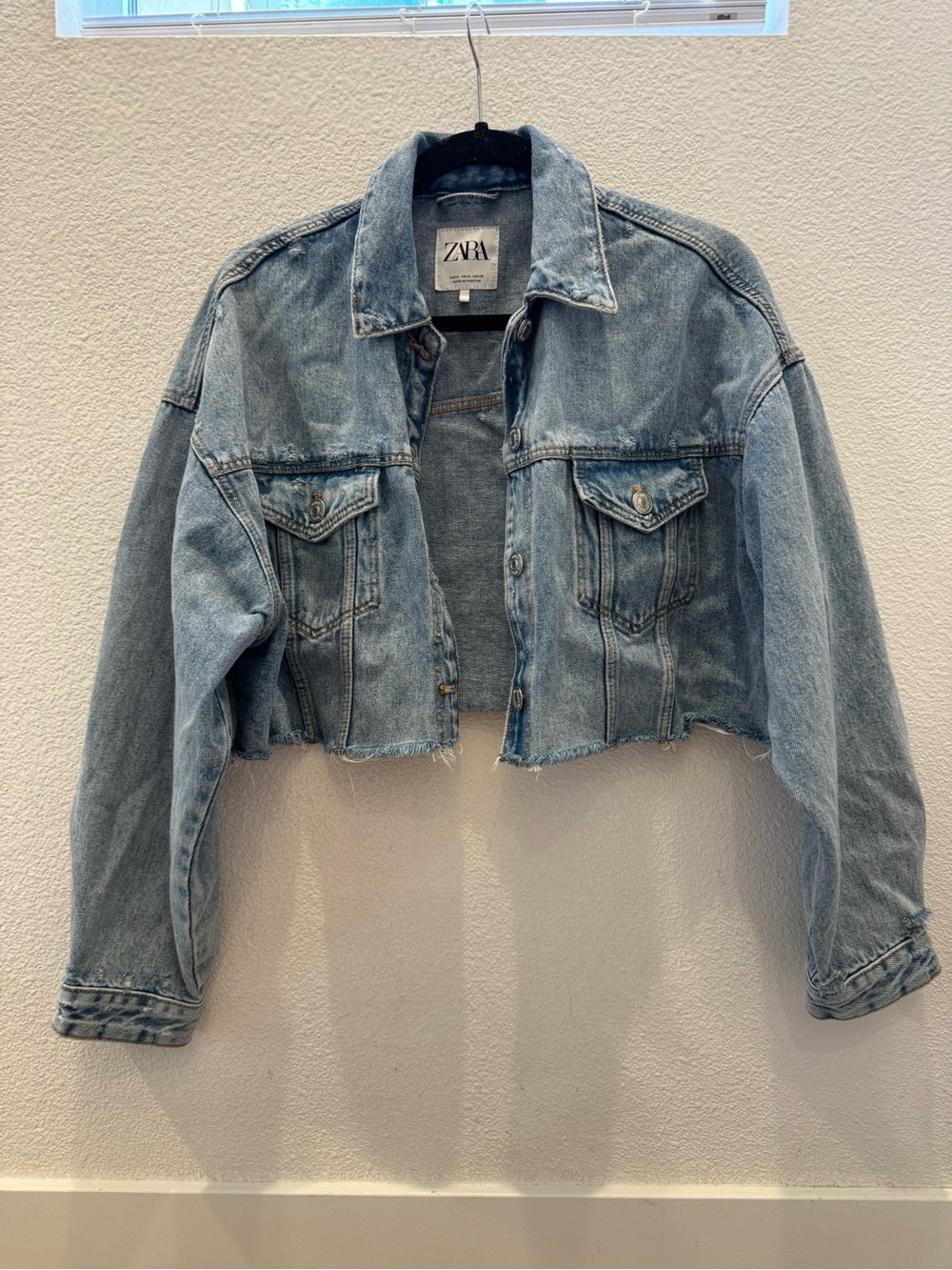 Zara blue denim cropped jacket w/ a raw edge hem & chest button-flap pockets